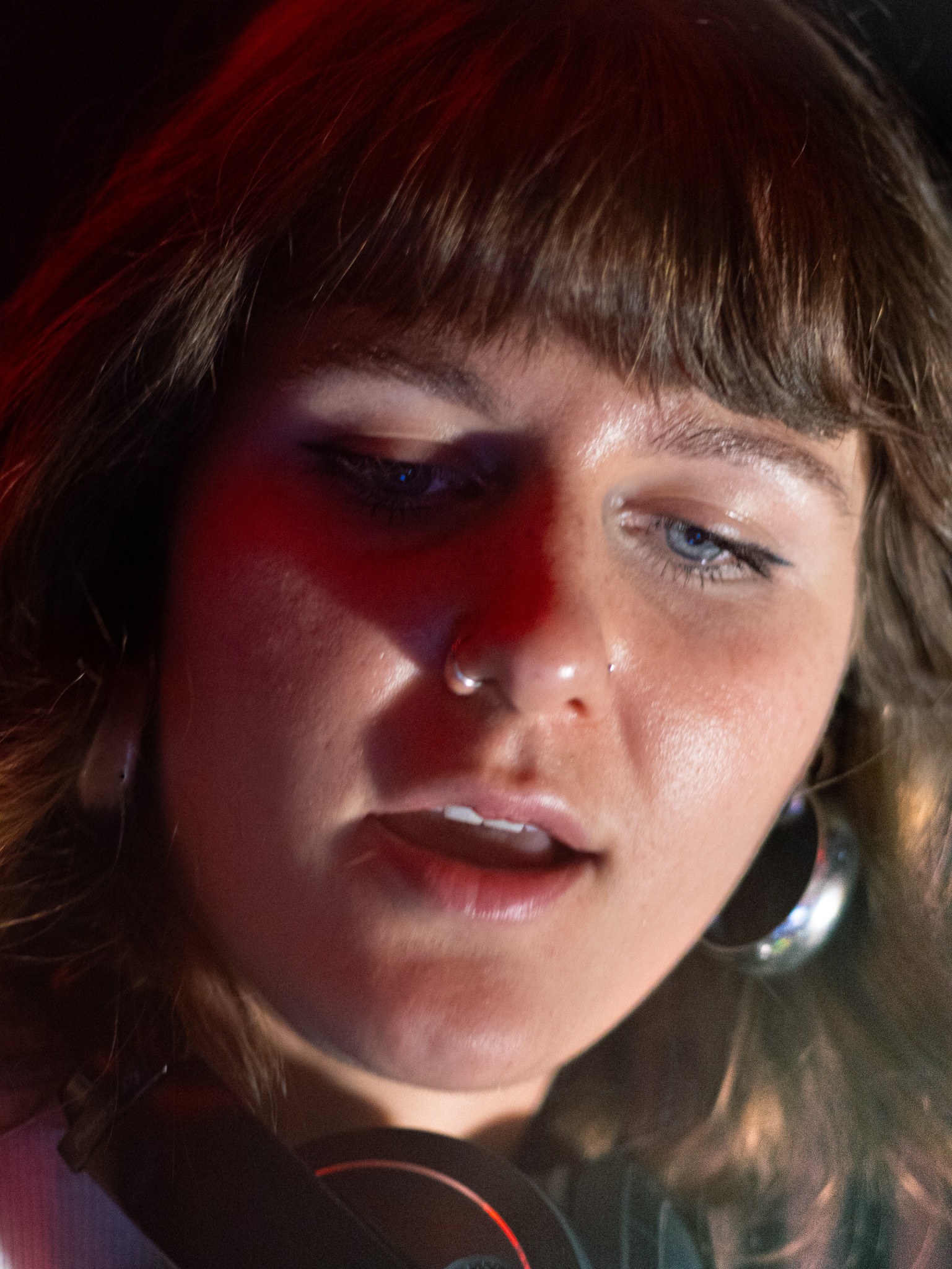 Close-up Munanos portrait under red event lighting